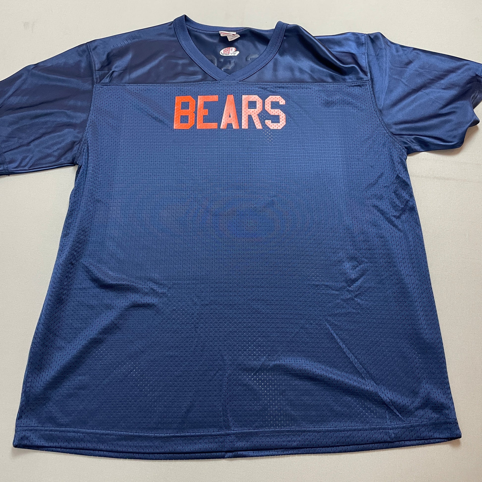 Blue sports jersey with 'BEARS' printed on it, laid flat on a surface.